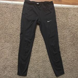 Nike Navy Woman’s Md Performance Leggings with Silver Swoosh Back Zipper Pocket